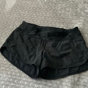 Women’s black 2.5 running shorts. Size 4
